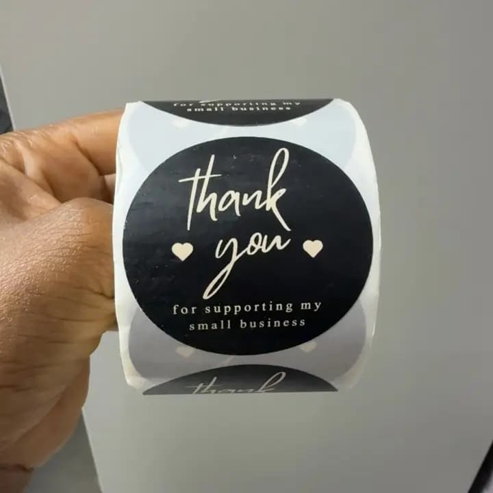 Black "THANKYOU" stickers roll.