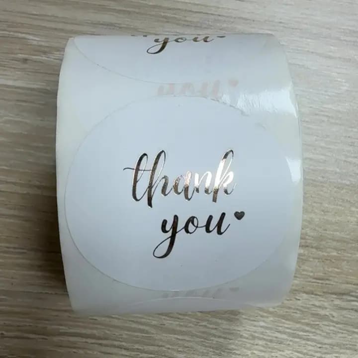 White  "THANKYOU" stickers roll.
