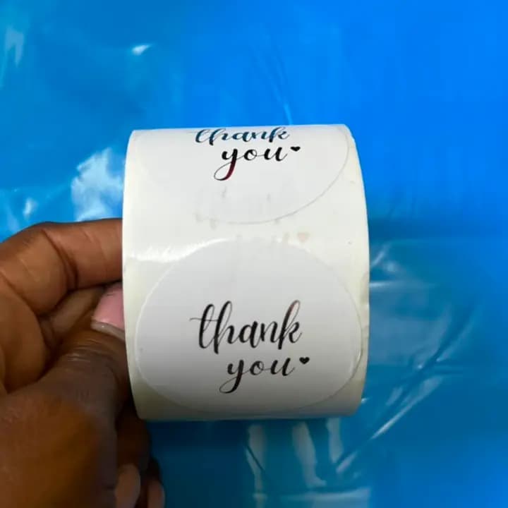White  "THANKYOU" stickers roll.