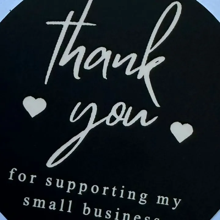 Black "THANKYOU" stickers roll.